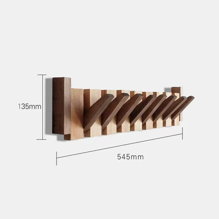 Lifestyle shot of piano-style wooden coat rack holding bags in a modern hallway