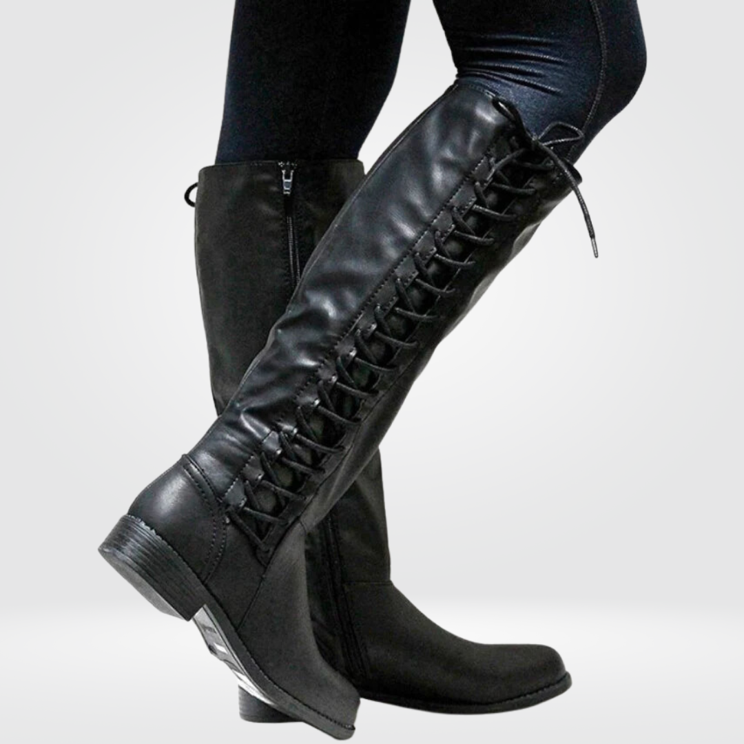 Woman wearing black high boots with lace-up detail and low block heel