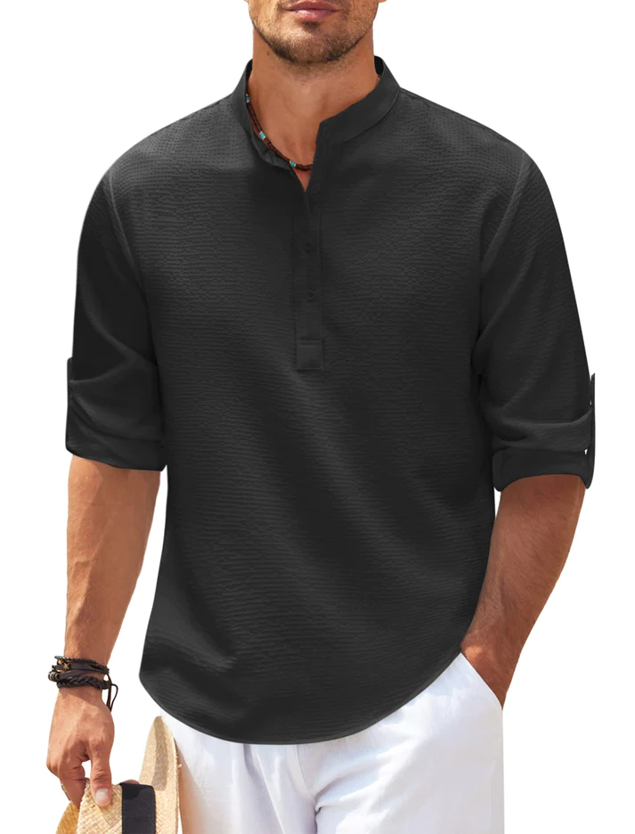 Man wearing a black urban casual long-sleeve shirt with mandarin collar