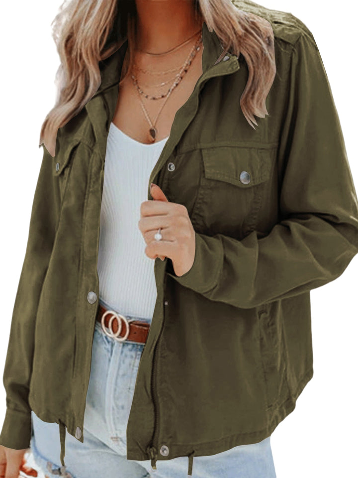 Close-up of a woman wearing a dark green utility style jacket