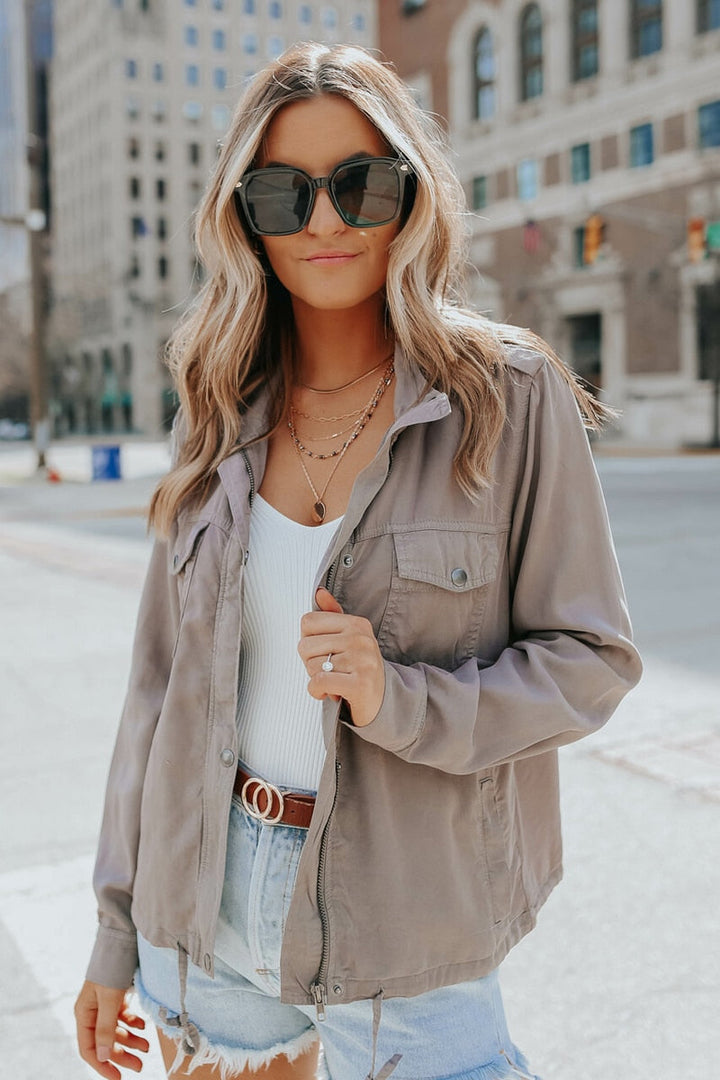 Woman wearing a stylish khaki casual jacket outdoors