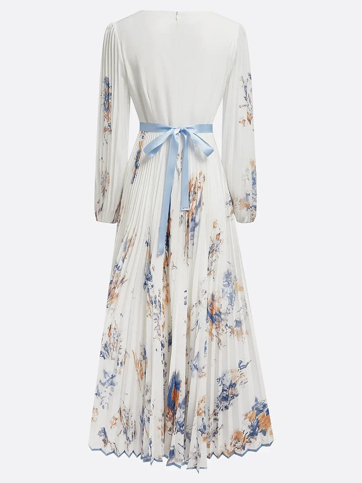 Womens floral v-neck pleated maxi dress showing front bodice and long sleeves