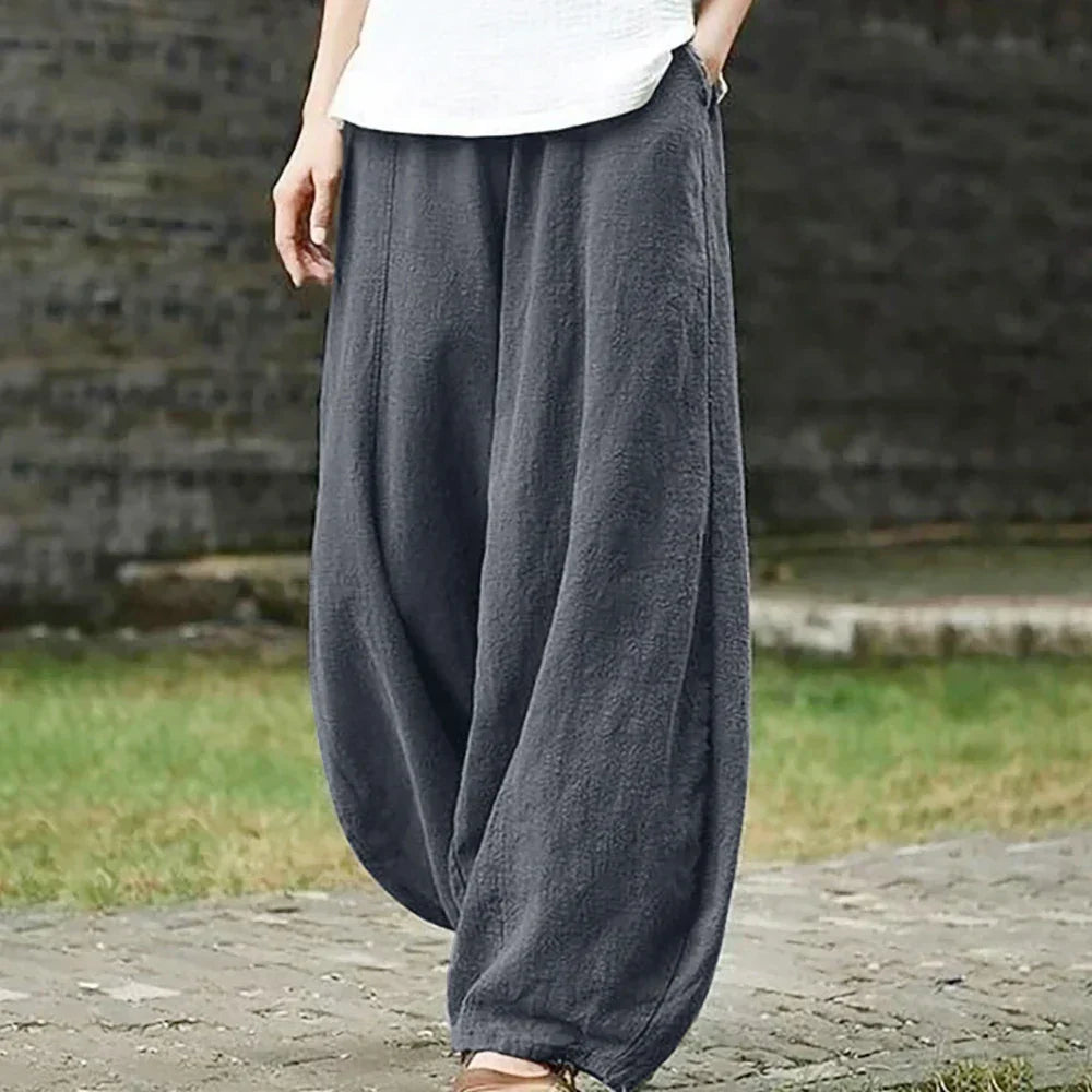 Woman wearing gray wide leg harem pants outdoors