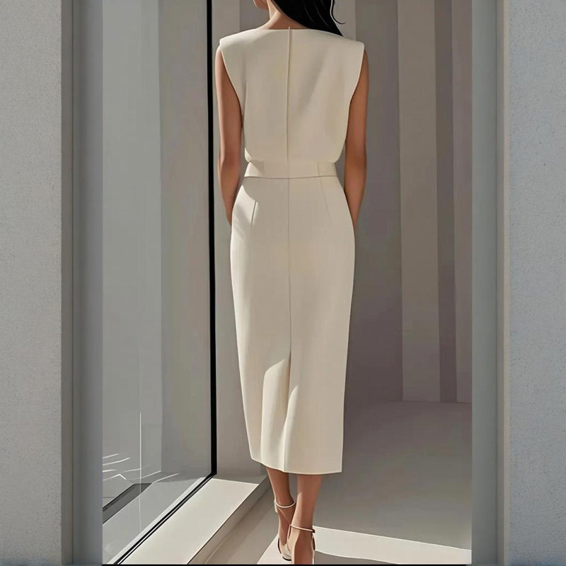 Back view of a woman wearing the elegant white midi dress with seamed panel detail
