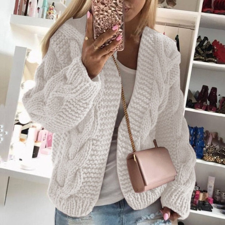 Detailed view of the chunky cable knit texture on the women's oversized open front cardigan.