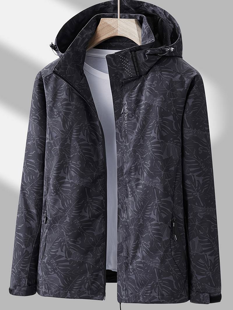 Black women's waterproof hooded jacket with leaf pattern hanging on a hanger