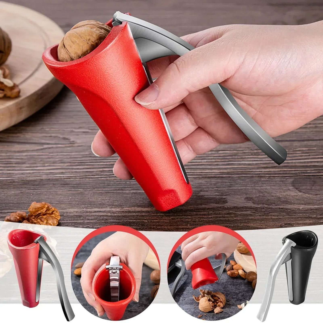 A person using a red ergonomic nutcracker to crack a walnut effortlessly on a wooden table.