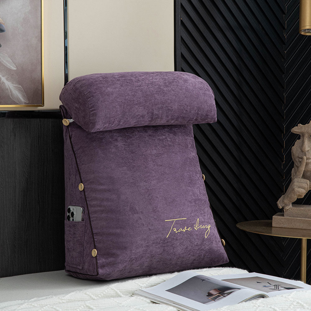 Plush back support cushion arranged neatly on a made bed