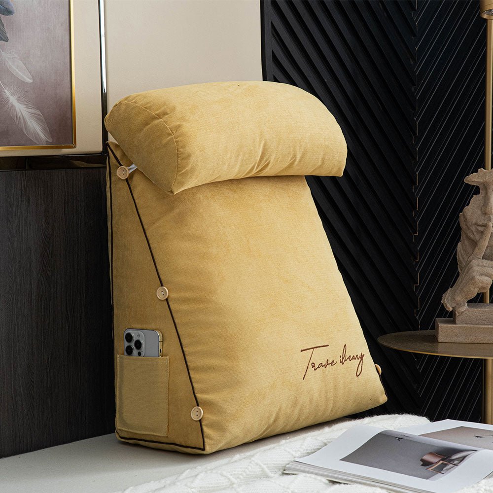 Yellow ergonomic reading pillow displaying side storage pocket and modern design