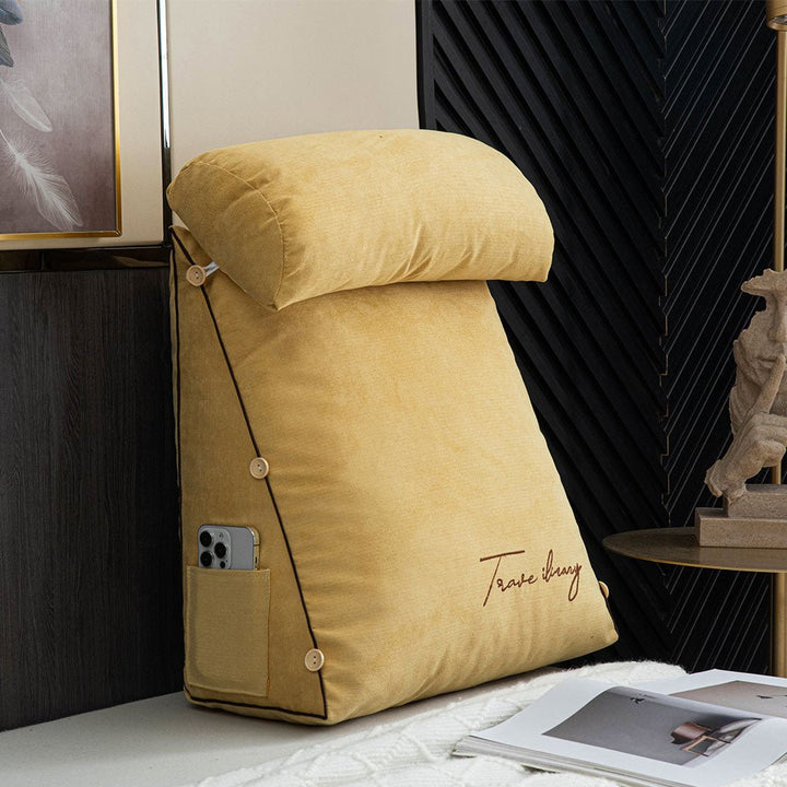 Yellow ergonomic reading pillow displaying side storage pocket and modern design