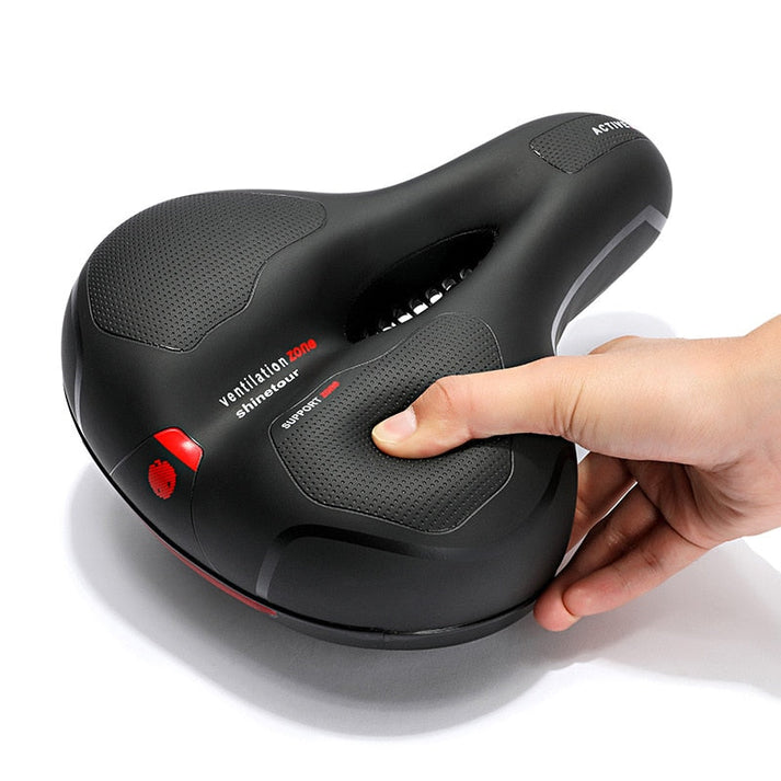 Close-up of ergonomic bike saddle showing cushioning and ventilation zone
