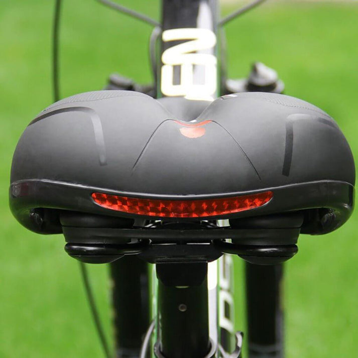Side profile of ergonomic bike saddle showing contour and relief channel