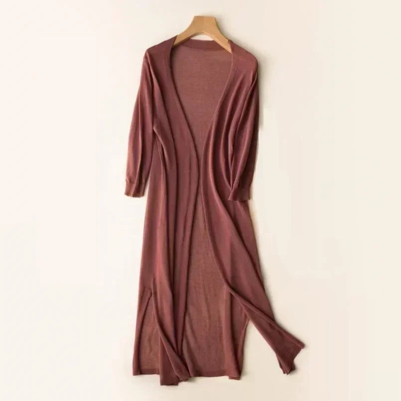 Brown women's long open front cardigan hanging on a wooden hanger