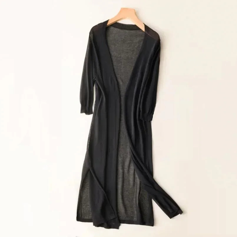 Black women's long open front cardigan shown on a hanger