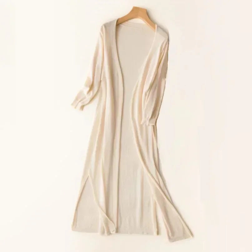 Comfortable women's knit cardigan hanging on display