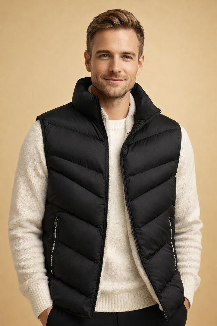 Man wearing black insulated puffer vest posing confidently
