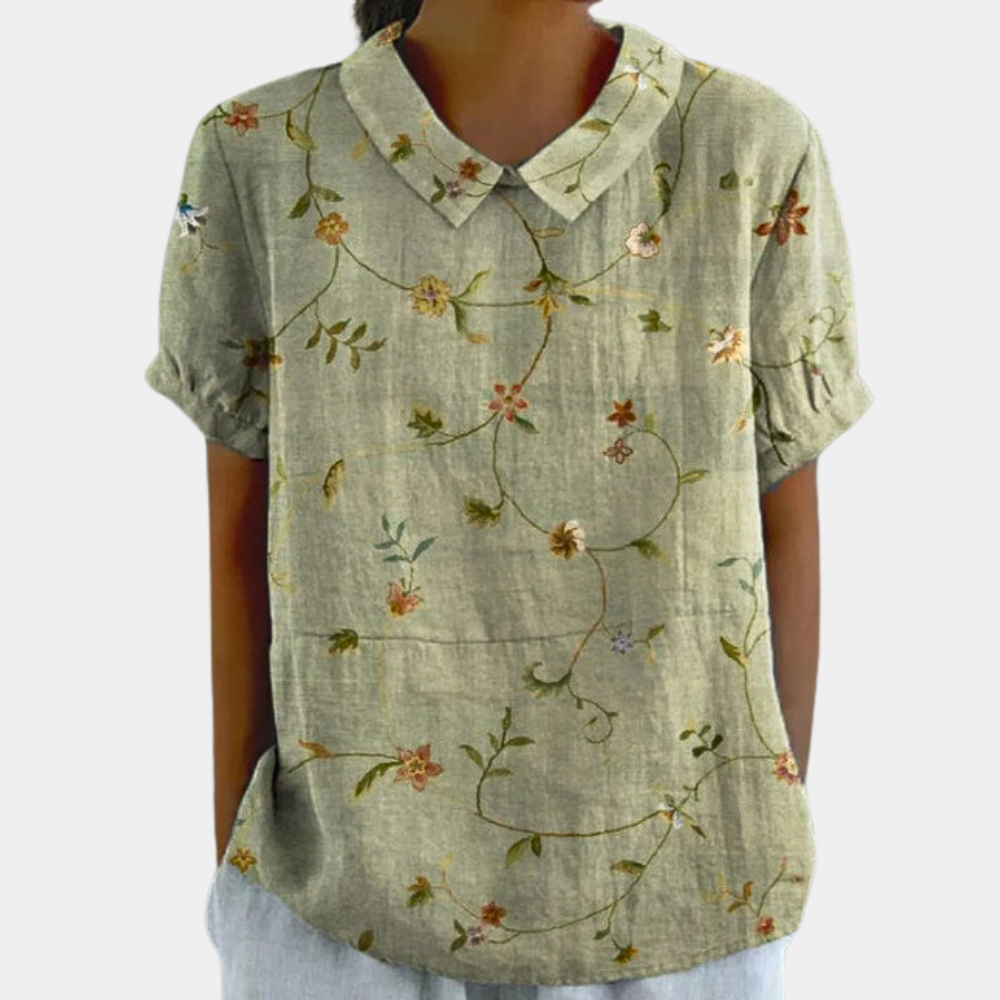 Woman wearing green botanical print casual blouse