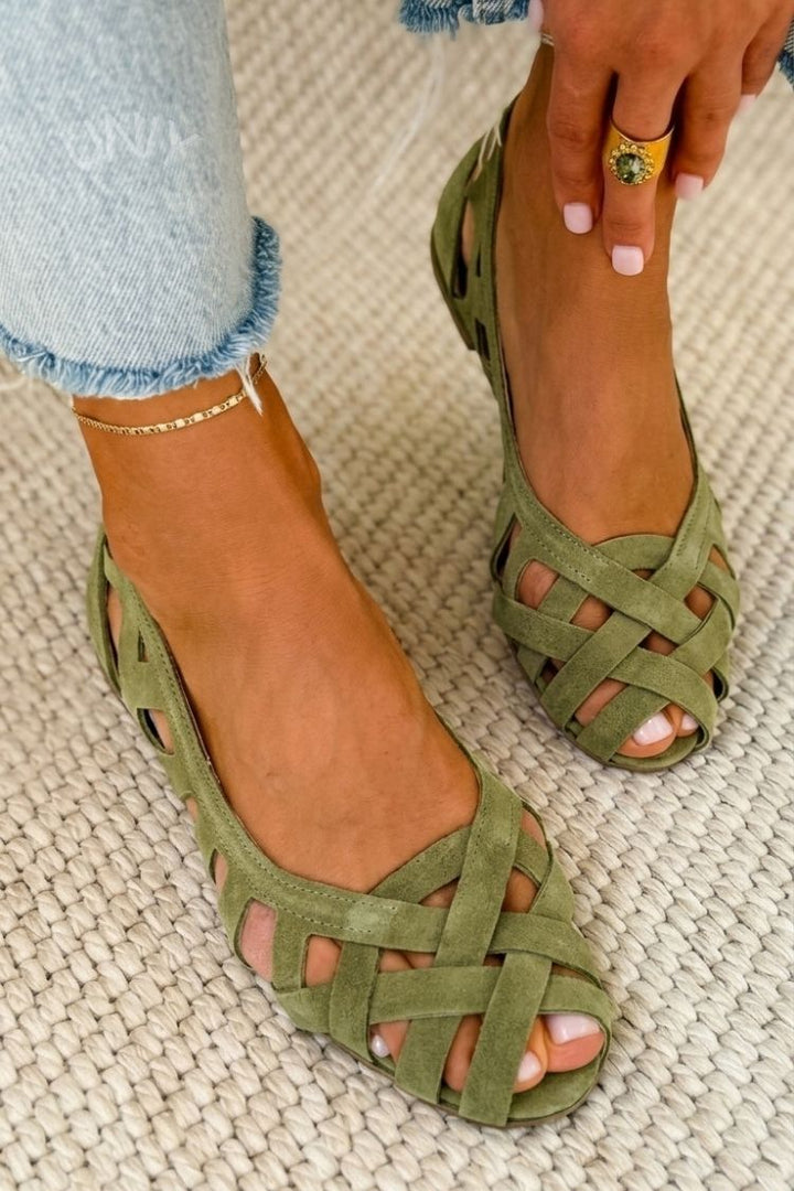 Lifestyle shot of women's chic woven sandals flat summer shoes