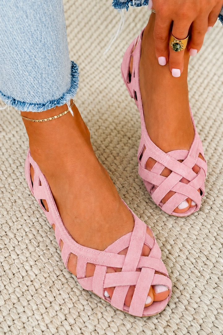 Detailed shot of sole and woven upper on women's chic flat sandals