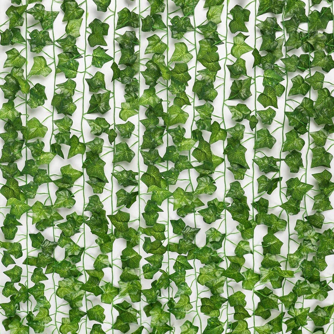 Close-up view of vibrant green artificial ivy leaves on hanging vines
