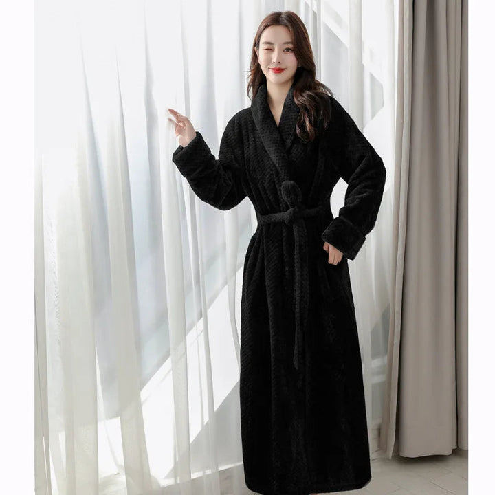 Close up of soft plush fabric and shawl collar on women's winter sleepwear robe