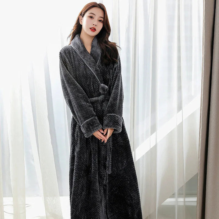 Full length view of women's plush long bathrobe with tie belt in cozy fabric
