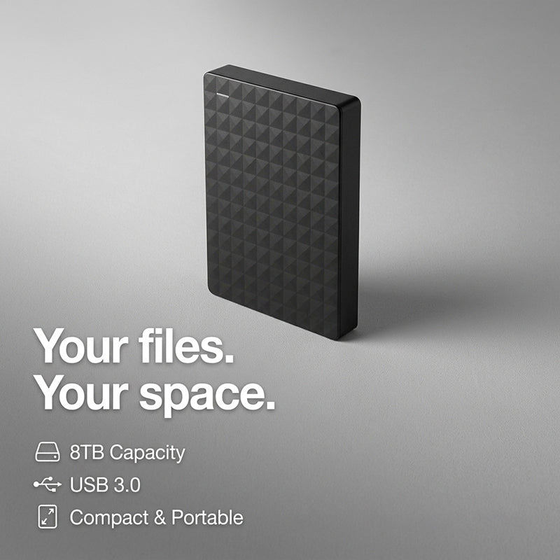 Portable data storage device resting on a wooden office desk