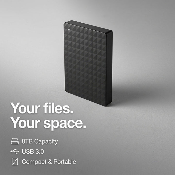 Portable data storage device resting on a wooden office desk