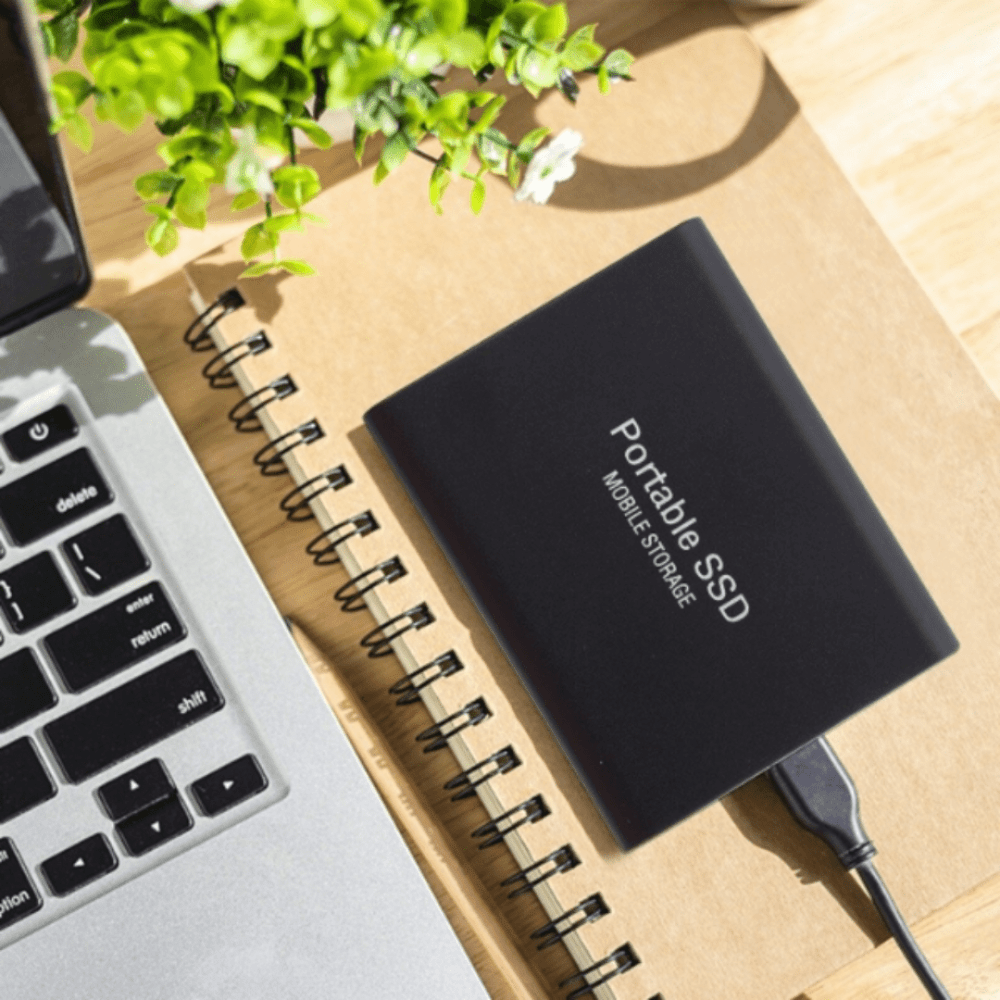Universal portable external SSD drive showing high-speed USB-C connection port for fast file transfer.