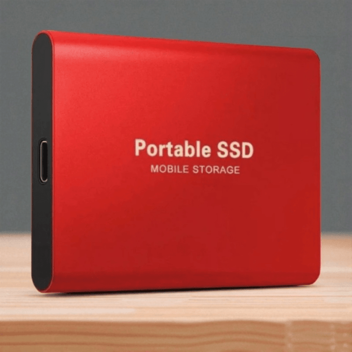 Compact 2TB external SSD resting on a desk, highlighting its sleek portable design.