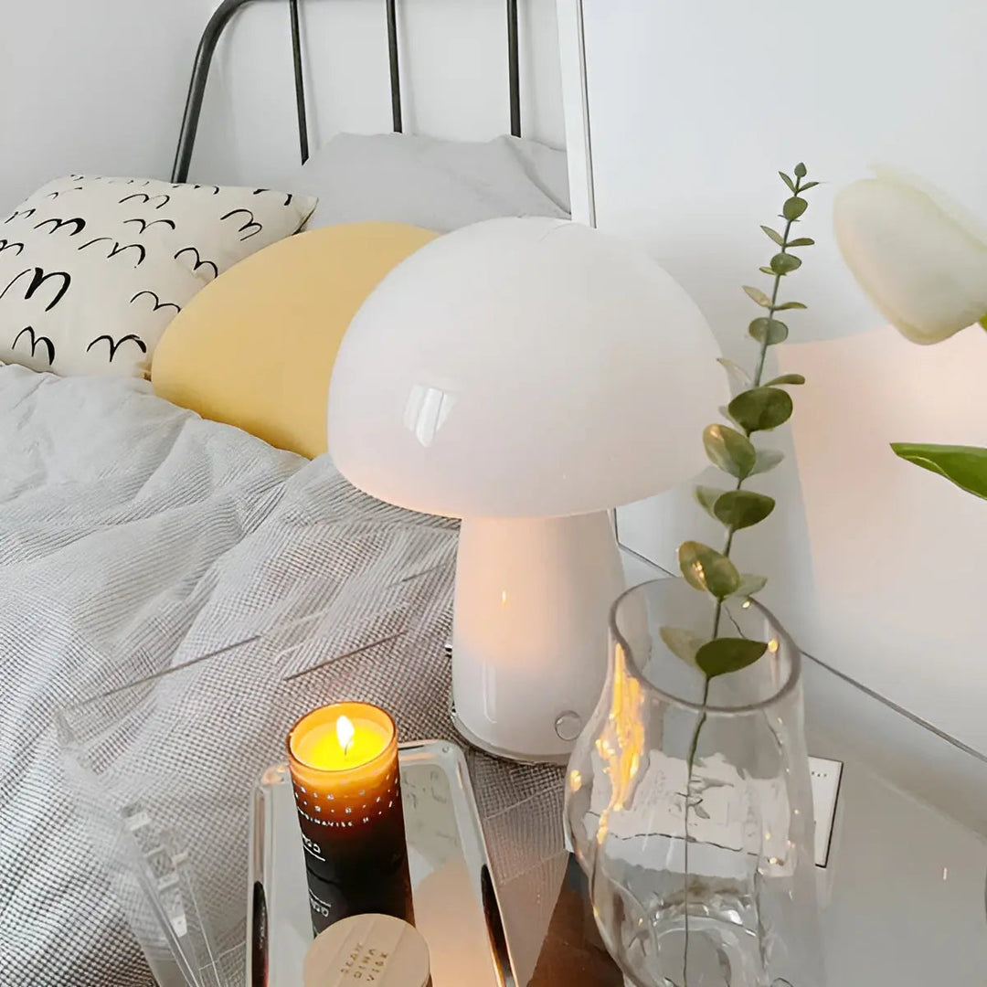 White Nordic LED Mushroom Table Lamp on a bedside table with decorative items