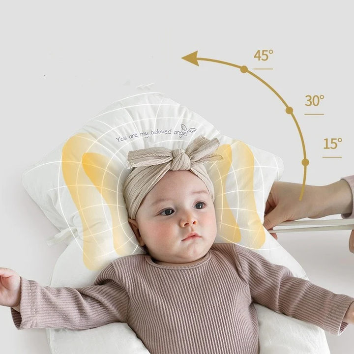 Close-up of the baby pillow fabric and ergonomic curve for infant head support