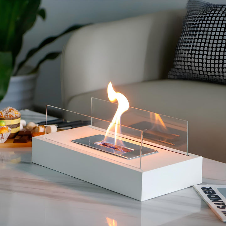 White FireGlow tabletop bio-ethanol fireplace burning on a living room table