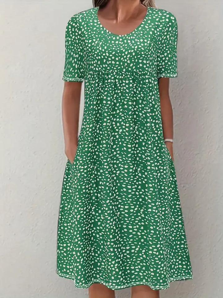 Close-up of fabric and short sleeves on a casual summer printed midi dress