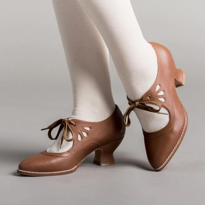 Front angle of stylish women's low heels combining professional fashion with orthopedic comfort.