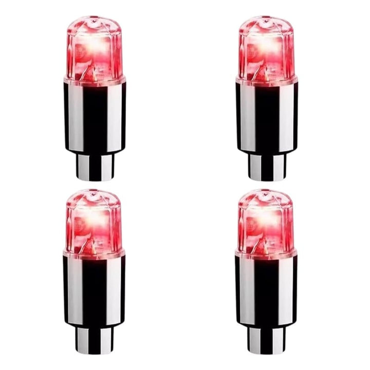Four red LED tire valve cap lights displayed in a square layout