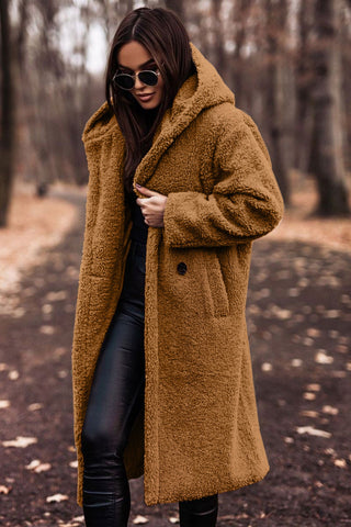 Close-up of black women's winter coat showing warm hood and durable fabric