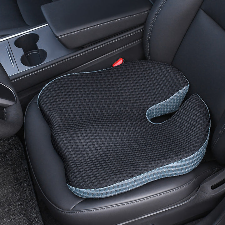 Ergonomic car cushion placed on a driver seat for daily commute comfort
