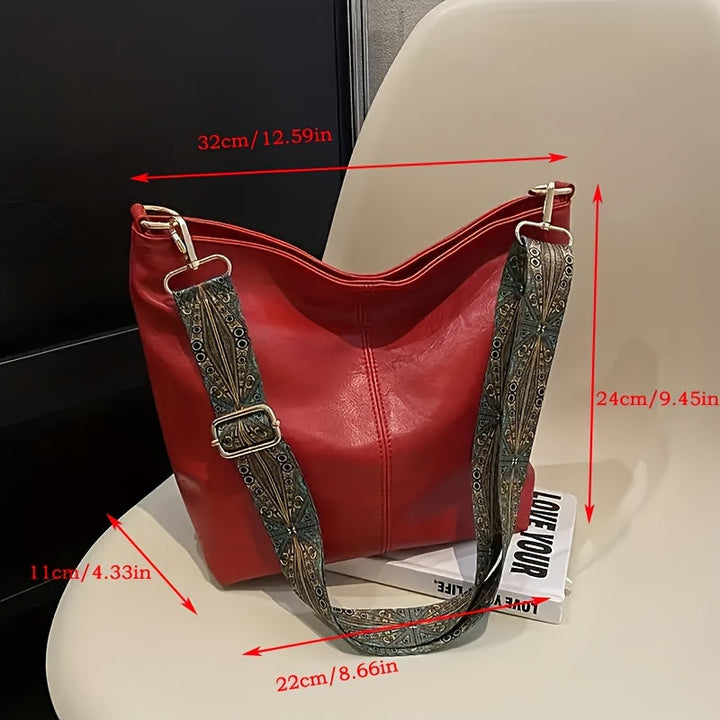 Side angle view of the oversized geometric handbag showcasing its depth