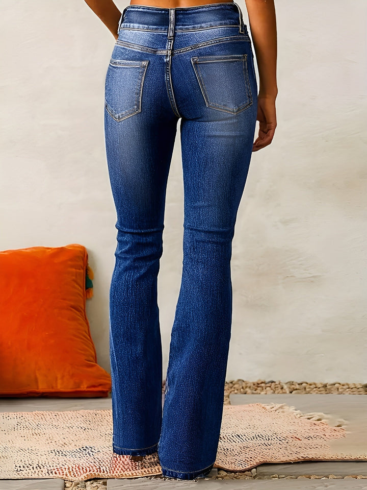 Close-up fabric detail of comfortable stretch women's retro flared jeans