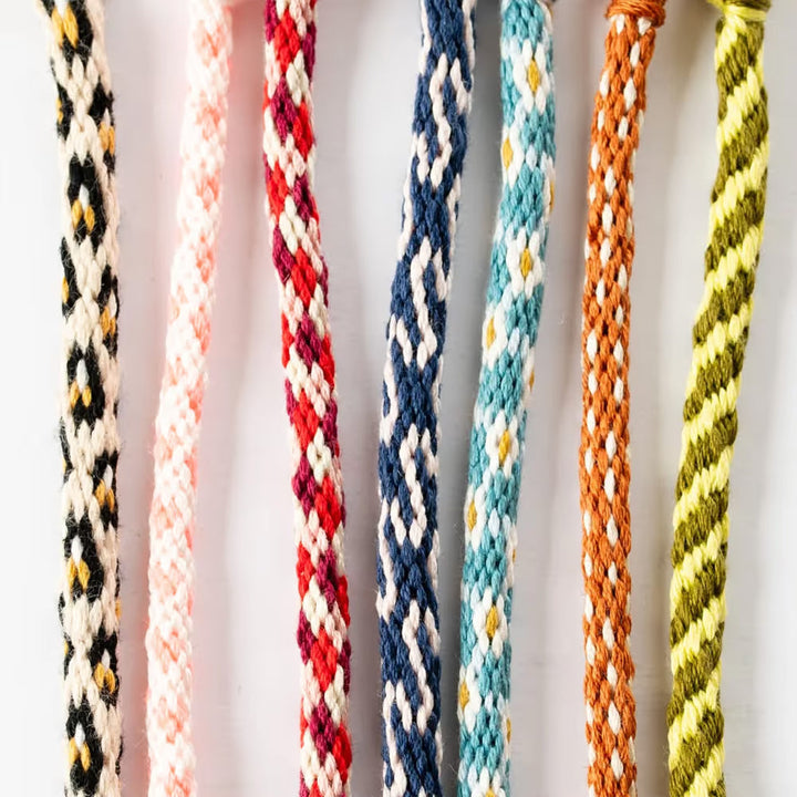 Close-up of vibrant embroidery floss threads included in the craft kit