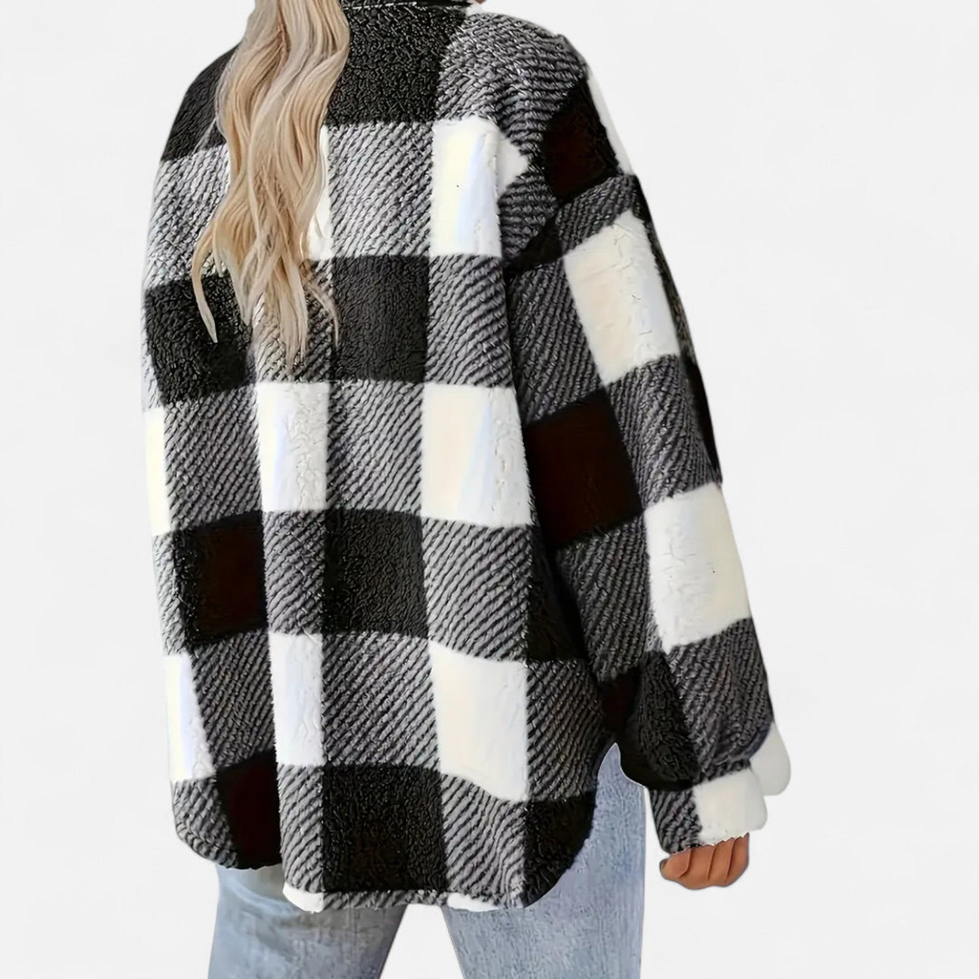 Close-up of cuff and sleeve detailing on a women's winter plaid shirt jacket