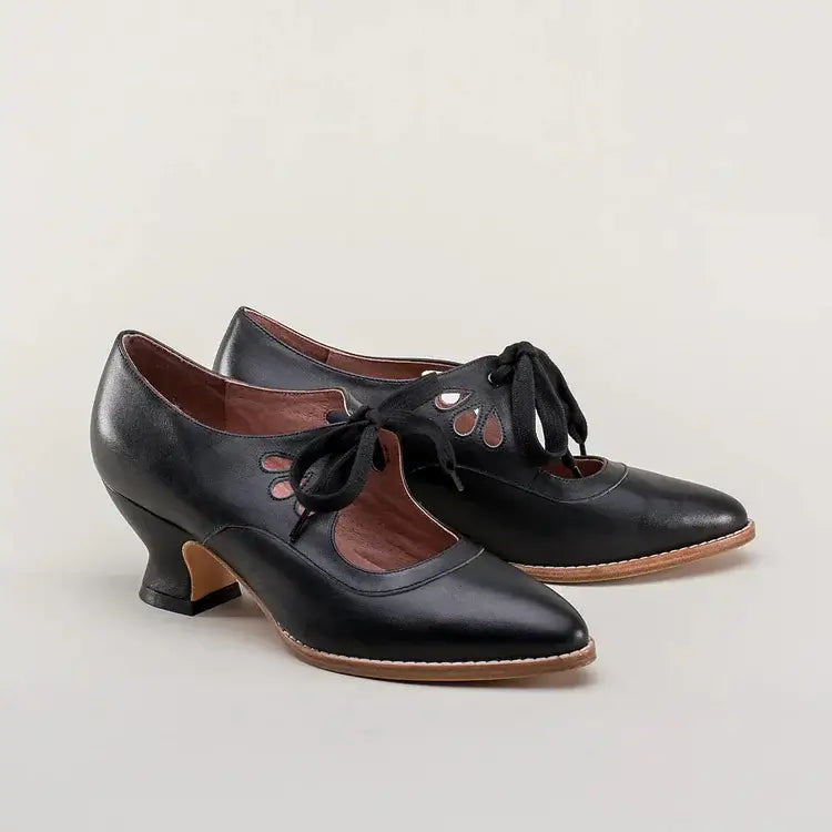 Back view of women's comfortable dress shoes highlighting the stable, supportive low heel block.