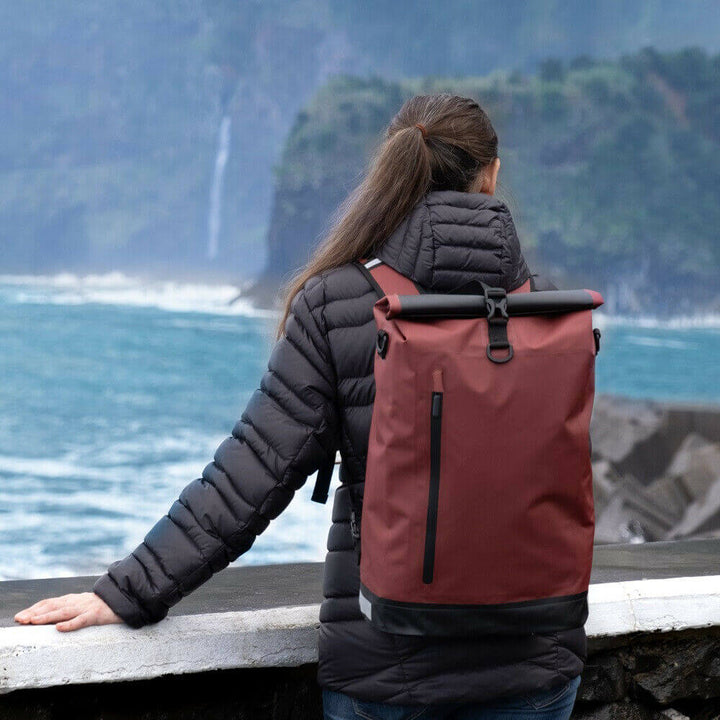 Side profile of the slim waterproof bike bag packed for a daily commute