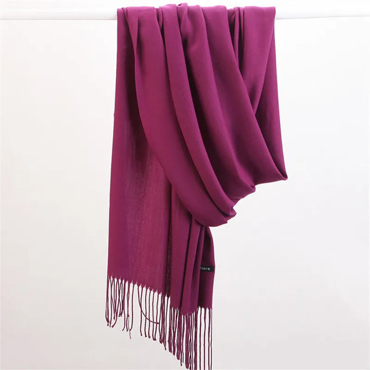 Stylish woman wearing warm cashmere scarf for cold weather fashion