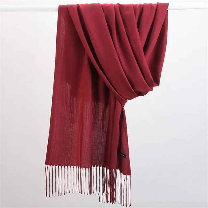 Close-up view of soft fabric texture on a solid color winter scarf