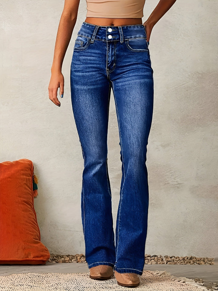 Woman wearing dark blue flared jeans with classic styling