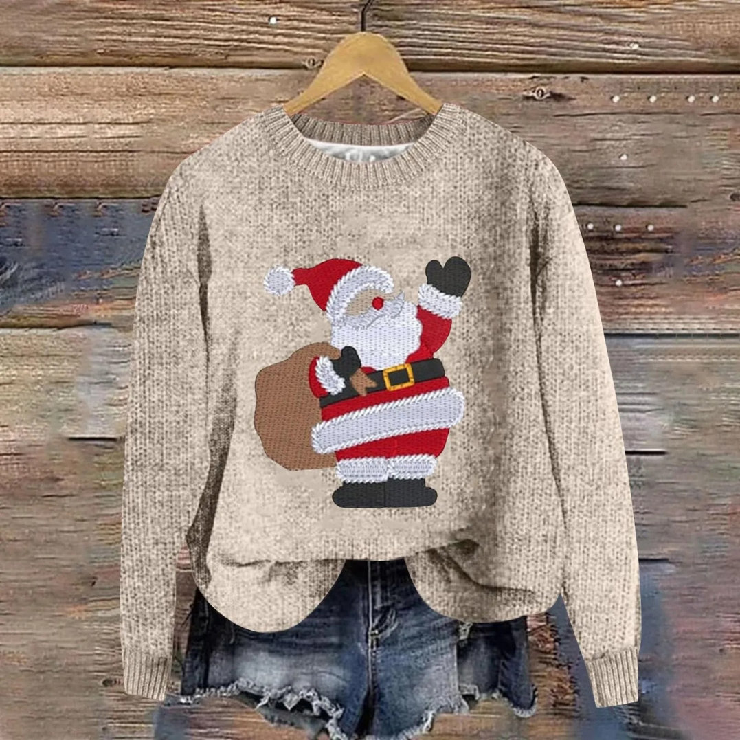 Beige women's Christmas sweater with a Santa graphic hanging on a wooden wall