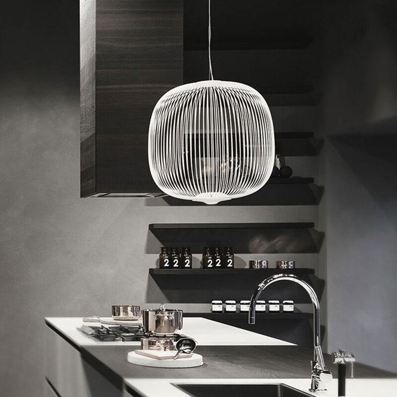 Modern iron ceiling lamp illuminating a dining room with statement lighting design