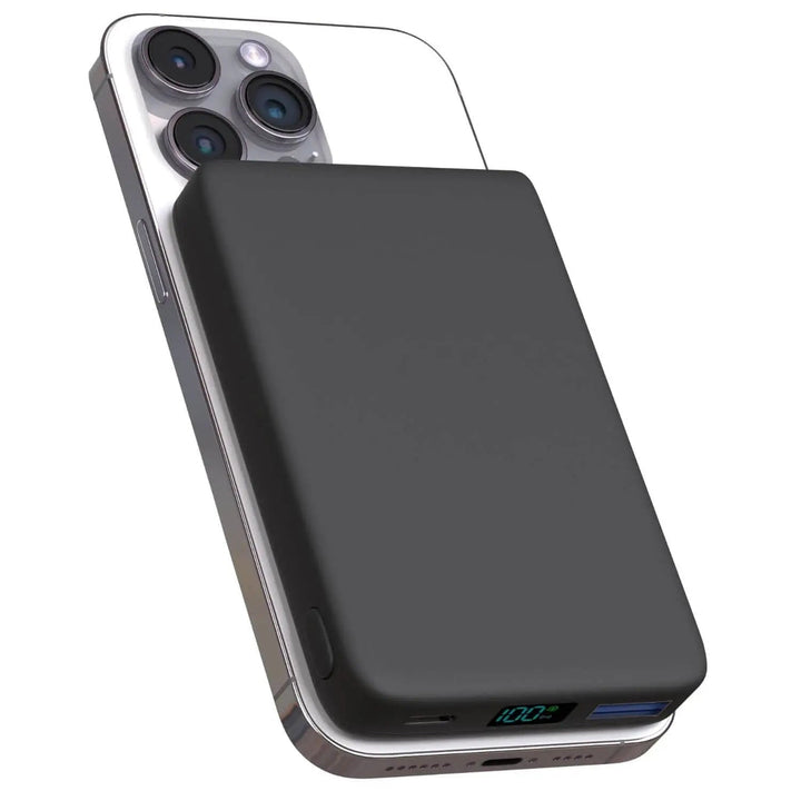 Black wireless MagSafe power bank attached to the back of a smartphone
